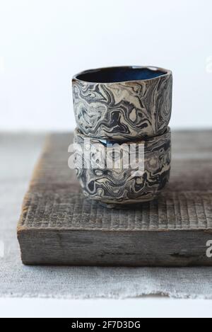 Handmade ceramic cups in the style of wabi sabi. Stock Photo