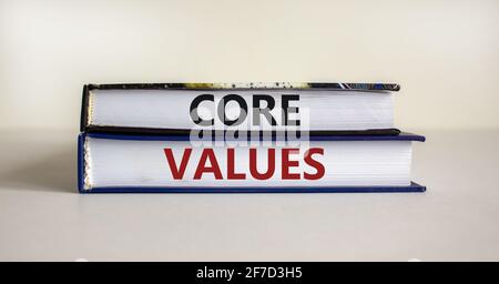 Core values symbol. Books with words 'core values' on beautiful wooden table. White background. Business and core values concept. Copy space. Stock Photo