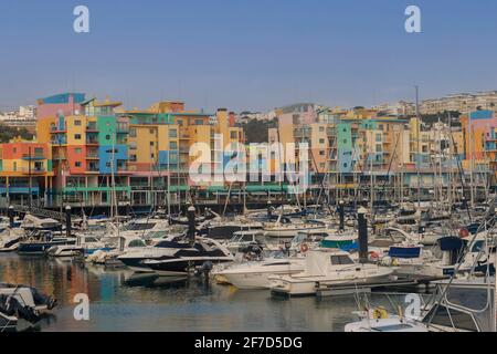 Boats, yachts, colourful buildings, Albufeira Marina, Algarve, Portugal Stock Photo