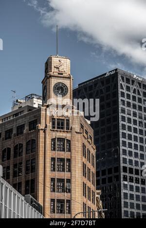 Beautiful old skyscraper with clock and relief in downtown Wellington, New Zealand Stock Photo