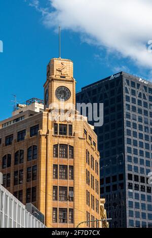 Beautiful old skyscraper with clock and relief in downtown Wellington, New Zealand Stock Photo