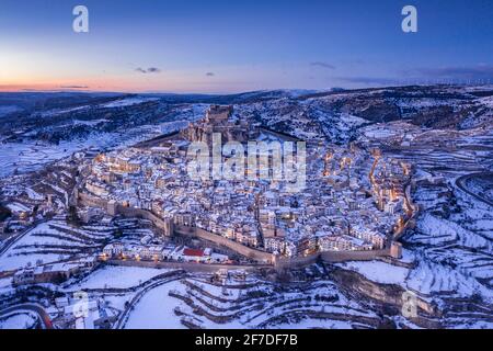 Morella medieval city aerial view, in a winter blue hour, after a snowfall (Castellón, Valencian Community, Spain) ESP: Vista aérea de Morella nevada Stock Photo