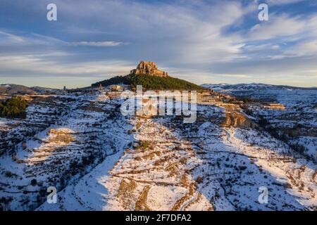 Morella medieval city aerial view, in a winter sunset, after a snowfall (Castellón province, Valencian Community, Spain) ESP: Vista aérea de Morella Stock Photo