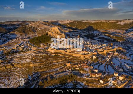 Morella medieval city aerial view, in a winter sunset, after a snowfall (Castellón province, Valencian Community, Spain) ESP: Vista aérea de Morella Stock Photo