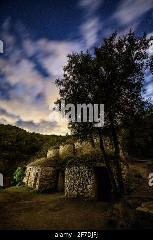 Tines del Tosques vats in the route of Tines de la Vall del Flequer (vats), in Bages region, on a cloudy night (Barcelona province, Catalonia, Spain) Stock Photo
