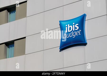 Lugano, Ticino, Switzerland - 16th March 2021 : Ibis Budget Hotels sign hanging on the hotel building in Paradiso, Switzerland. is a brand of economy Stock Photo