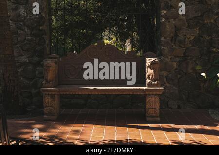 Mexico, Valle de Bravo March 26, 2021, view of the interior of the "Casa De Oración Carmel Maranatha" a house of prayer, there is a bench carved in st Stock Photo