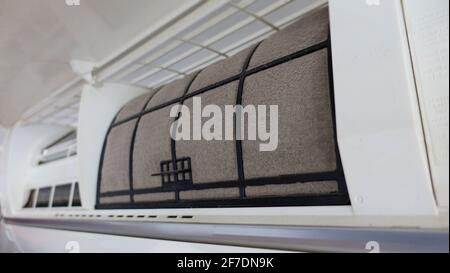 View of dirty and dusty filters on the air conditioner for washing and cleaning. The concept for maintenance of hygiene and pure air to prevent allergies. Stock Photo
