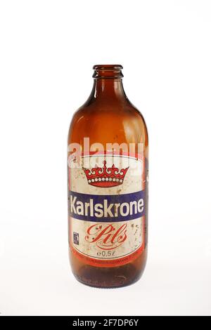 Old empty Karlskrone Pils beer bottle Stock Photo