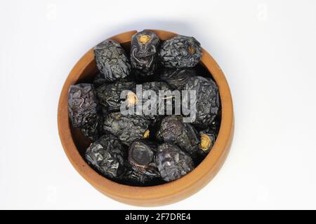 Ajwa dates. Dried dates. Prophet dates on white background. Iftar time Stock Photo