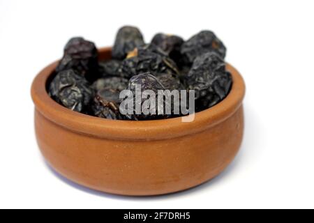 Ajwa dates. Dried dates. Prophet dates on white background. Iftar time Stock Photo