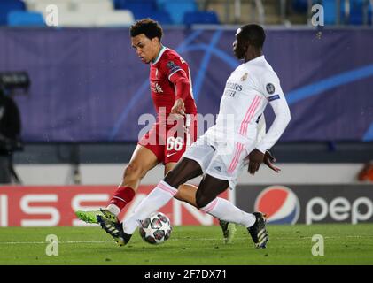 Real Madrid's Jose Vinicius Junior is fouled by Liverpool's Trent Alexander-Arnold (left) during the UEFA Champions League match at the Alfredo Di Stefano Stadium, Madrid. Picture date: Tuesday April 6, 2021. Stock Photo