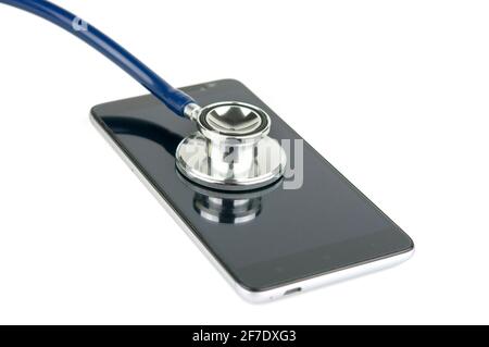 Stethoscope on the smartphone isolated on a white background. Phone repair and service concept. Concept a health of device. Stock Photo