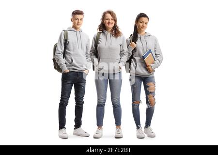 Full length portrait of a group of students wearing hoodies isolated on white background Stock Photo