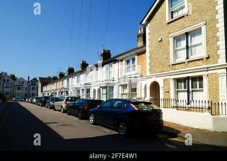 Terraced yellow clay brick houses on Mountfield Road, lookign towards Grove Hill, Royal Tunbridge Wells, Kent, England Stock Photo