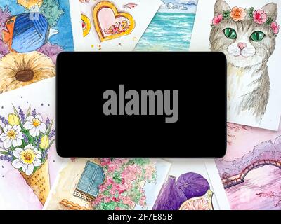 Black tablet, watercolor sketches. Online education concept. Stock Photo