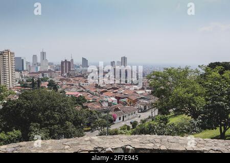 Panorama photo of Cali in Colombia, viewed from a higher perspective. Looking towards CBD of Cali on a hazy but sunny day. Stock Photo