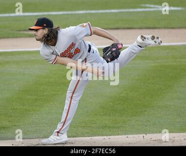 BALTIMORE, MD - JULY 04: Baltimore Orioles starting pitcher Dean Kremer  (64) turns and throws to first during a MLB game between the Baltimore  Orioles and the Texas Rangers, on July 04