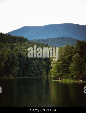 The forest around Shenandoah National Park reflecting in Lake Arrowhead in Luray, VA. Stock Photo