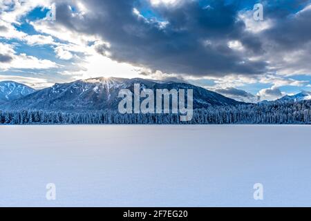 Sunset over the mountains and fresh snow on Lake Lillian near Invermere, BC Stock Photo