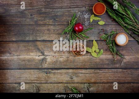 Various herbs and spices on wooden background. Stock Photo