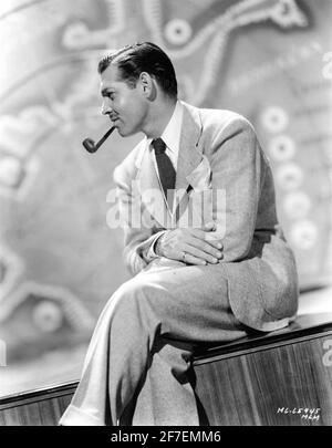 CLARK GABLE smoking Pipe 1938 Portrait publicity for Metro Goldwyn Mayer Stock Photo