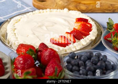 Homemade strawberries cake made from meringue cake and cream with strawberries. Stock Photo
