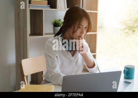 User experience concept. Creative Web Designer sketching application and developing template layout on laptop, framework for digital devices. Stock Photo
