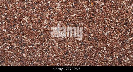 Texture of small stones, rocky abstract background, grainy surface, gravel pattern, red pebbles. Decorative design, brown colored. Grunge wall backdro Stock Photo
