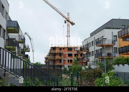 Prague, Czech Republic - May 23 2020: New modern residential building contruction work with crane in aglomeration of Prague city center Stock Photo