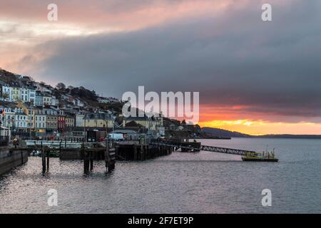 Cobh, County Cork, Ireland. 7th Apr, 2021. The sun rises behind clouds over the County Cork town of Cobh this morning. Credit: AG News/Alamy Live News Stock Photo