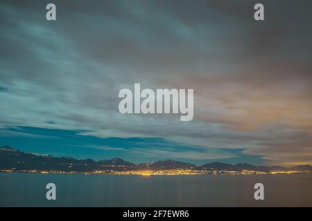 Panorama of the lake of Leman or Lac Leman on a cold winter night. Late night panorama of Lac Leman. Stock Photo