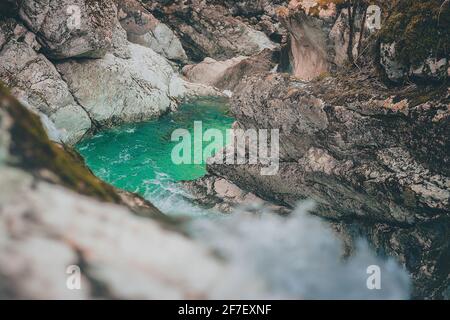 Beautiful water cascades or small waterfall in the valley of Lepena in Slovenian Julian Alps. Emerald green waterfalls in an enchanted forest. Sunikov Stock Photo