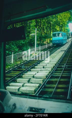 Old funicular of Kiev, view from the driver perspective of one of the carriages, looking up towards another carriage going downhill. Stock Photo