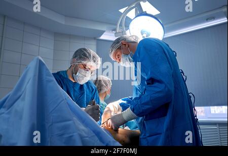 doctors work hard in the operating room Stock Photo