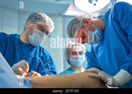 doctors work hard in the operating room Stock Photo
