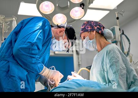 doctors work hard in the operating room Stock Photo