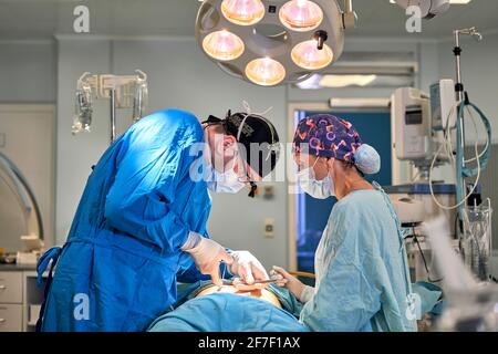 doctors work hard in the operating room Stock Photo