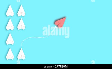 Group of paper planes going in one direction and one pointing in the different way. Business concept, new ideas, creativity and innovative solution Stock Photo