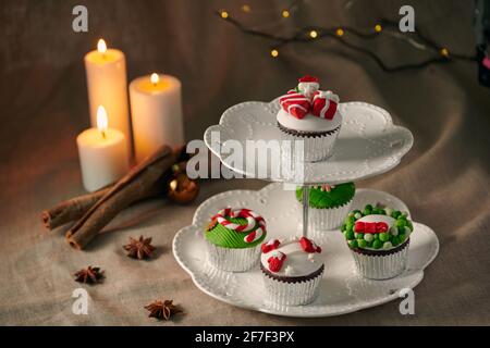 Christmas sweets: cupcakes closeup on a linen background. Stock Photo