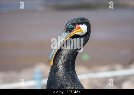 Close up of cast iron bird statue on a post in Morecambe, Lancashire Stock Photo