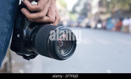 Photographer with camera in hand Stock Photo