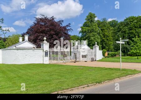 Gates at the entrance to Houghton Hall, a stately home in Norfolk, UK Stock Photo