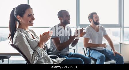 Website header of Young professional team discussing business plan in the office Stock Photo