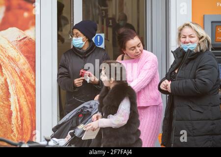 London, UK - 5 February, 2021 - Street people, some wearing protective face masks during the COVID-19 pandemic Stock Photo