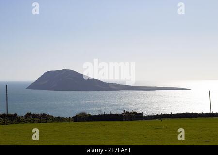 Aberdaron, Wales. Bardsey island seen from cliffs over the sea. Beautiful landscape. Blue sky and copy space. Stock Photo
