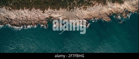 Aerial view of waves, rocks and transparent sea. Summer seascape with ...