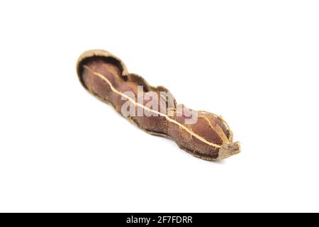 Tamarind or indian date fruit isolated on white background. Single tamarind pod Stock Photo