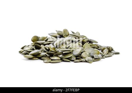 Seeds of gymnospermous pumpkin isolated on a white background. Pumpkin seeds Stock Photo