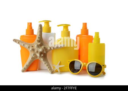 Sunscreens and summer accessories isolated on white background. Sunscreens with summer accessories isolated on white, holiday set Stock Photo